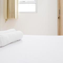 Homey 2BR at Puncak Permai Apartment By Travelio