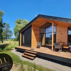 Werder Chalet -- GROßES SONNENDECK -- Strand 150m I Sauna I eKamin I bis 8 Pers I Meerblick I by "Meyers am Meer"