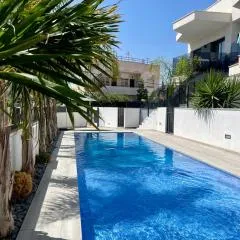 Air-conditioned Elisa Apartment with spacious sunroof lounge and swimming pool