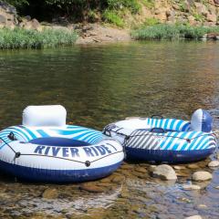 Wind down in this 2 Bed Oasis with River Access Hot Tub and Outdoor Fun Sleeps 6 Comfortably