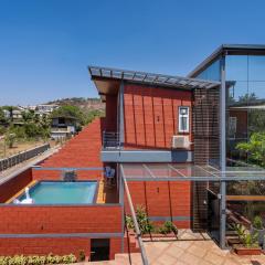 SaffronStays Hobbes - 3BR private pool villa with lawn, family lounge, BBQ nights & deck sit-outs, ideal for celebrations