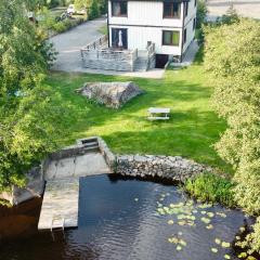 Holiday house by riverside with sauna and hottub