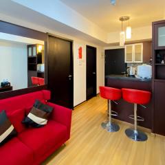 Elegant and and Spacious 1BR The Wave Kuningan Apartment By Travelio