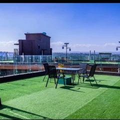 executive cozy apartment with fully equipped gym heated swimming pool and amazing scenic city views and ample parking and children playing ground