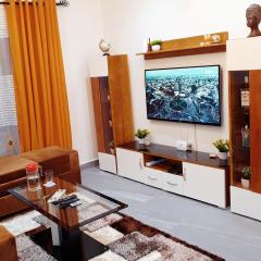 Appartement Cosy & Chill avec Groupe Electrogène, Forage, Parking, Gardien et WiFi