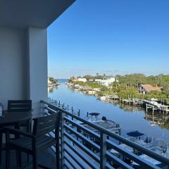 Luxury 2 Bed 2 Bath Waterfront Condo with Patio Sunsets Gym and Parking