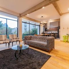 Modern Art Filled Home with Large Living Space and City Views