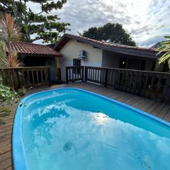 Casa privativa com piscina na Praia da Ferrugem duas quadras mar REF 100