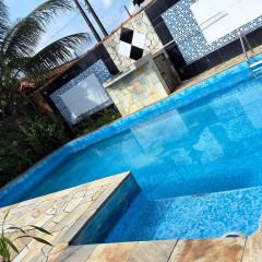 Casa com pisicna in Mongaguá