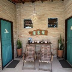 Suítes Curió - Passarim Hospedagem