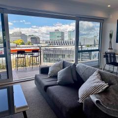 Panoramic City Views in a Modern Central Apartment