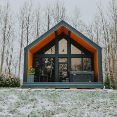 Sniegi design cabin with included sauna and jacuzzi