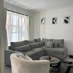 Secret Serenity - Modern, Stylish & Comfy 1 Bedroom Apartment With Workspace, Secure Parking, CCTV, Swimming Pool, Gym, And City Views in Nairobi
