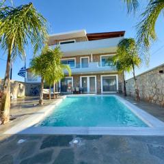 Odyssea Seaside Apartment with Sea View and Pool