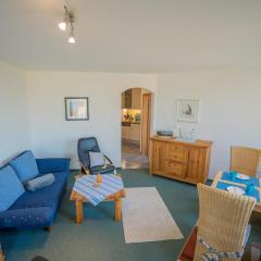 Inselblume 14 - Blaue Ferienwohnung mit Balkon am Südstrand