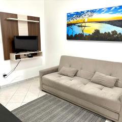 Apto aconchegante,Guilhermina PG Garagem e ar condicionado