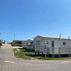 Promenade park 8 Berth caravan next to the beach entrance, WIFI included