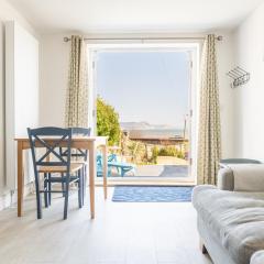 Stunning little house, 2 mins from Lyme Regis beach with a sea view to die for. Sleeps 2, free parking, small dog welcome.
