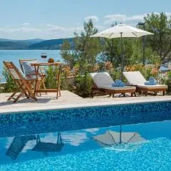 Seafront villa Noah with heated pool
