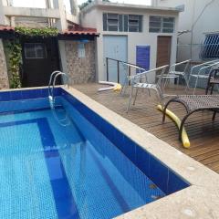 Flat aconchegante com Piscina e vista para o canal