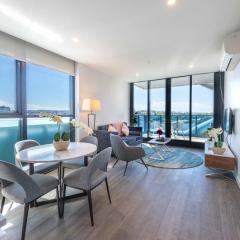 2BR Luxury Retreat with Rooftop Pool Access