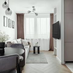 Bright Apartment Close to PGE with Parking by Noclegi Renters