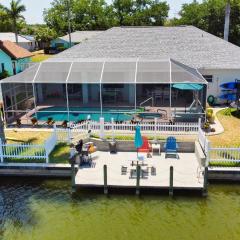 Luxury Waterfront Vacation Home with Dock and free heated Pool