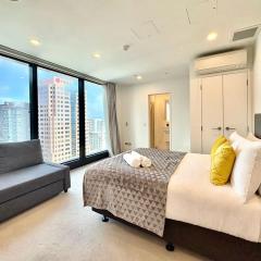 Spacious CBD Studio with AC and Skyline Window Views