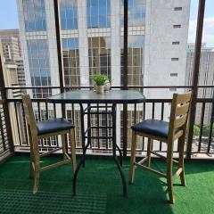 Cozy City Retreat With Balcony And Views