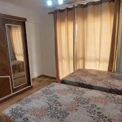 Fully finished 3-bedroom, 3-bathroom apartment with garden view in Jana Compound, Sheikh Zayed near Hyperone