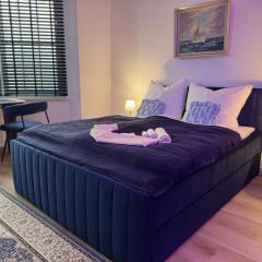 CuxHeaven - modernes Studio-Apartment direkt am Meer mit 65 Zoll TV und Tiefgarage in Duhnen