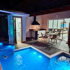 Casa em Boiçucanga com 2 suítes, piscina e sauna integrada
