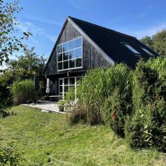 Lovely Beach Home Enveloped In Green Surroundings