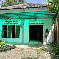 A two-bedroom home with natural light and green environment
