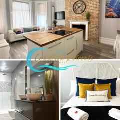 The Bournemouth Haven - Brought to you by Coastline Retreats - Grand 2 bedroom luxury apartment - 3 mins walk to beach - Superfast Wifi - Sleeps 6