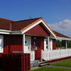 4 Personen Ferienhaus mit Kaminofen, Wintergarten und Kanu, mit einem wundervollen Blick auf den See in Otterndorf