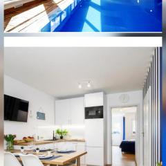 Apartament 2B Niebieskie Apartamenty Poddąbie z basenem krytym, odkrytym, salą zabaw, animacjami