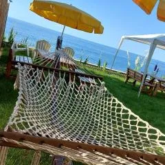 Seafront Apartment by the sea and with a beach and with big garden