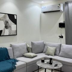 Luxury hotel suite with one bedroom and a living room