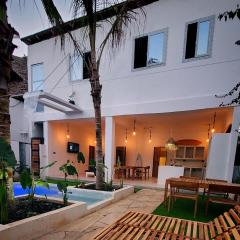 Luxury entire Private Villa Paje Beach Zanzibar TV WIFI AC private garden and cascading waterfall pool steps to the beach and amentites