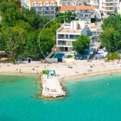 Beachfront Villa Erce with private 40sqm heated pool, a Gym, 7 en-suite bedrooms, a rooftop terrace, 2 living areas