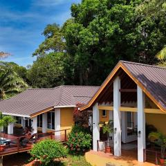Relax At This Hillside Retreat That Overlooks The Lush Forest And The Caribbean,