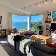 Elevated architectural home with stunning sea views