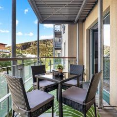 Central 2BR Park Royal Apartment with Balcony and Parking