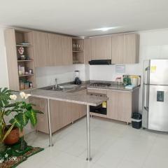 Habitación oliva con baño compartido cerca al aeropuerto