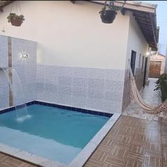 Casa com piscina e praia logo ali