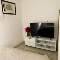 Quarto com suíte no Jardim Oceânico