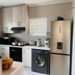 Modern Double-Story 2-Bedroom Townhouse with Private Backyard & Braai