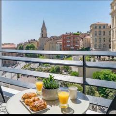 Studio climatisé vue église du Panier et hôtel intercontinental