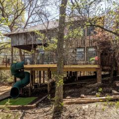 Magical Treehouse with Slide by Brazos River for Family Glamping Adventures in Texas